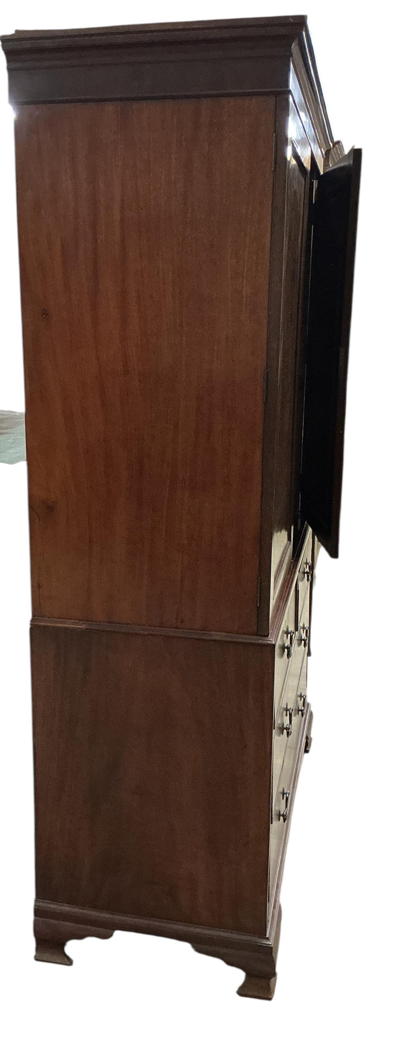 A George III satinwood banded mahogany linen press, converted to a hanging wardrobe, width 126cm, depth 55cm, height 206cm